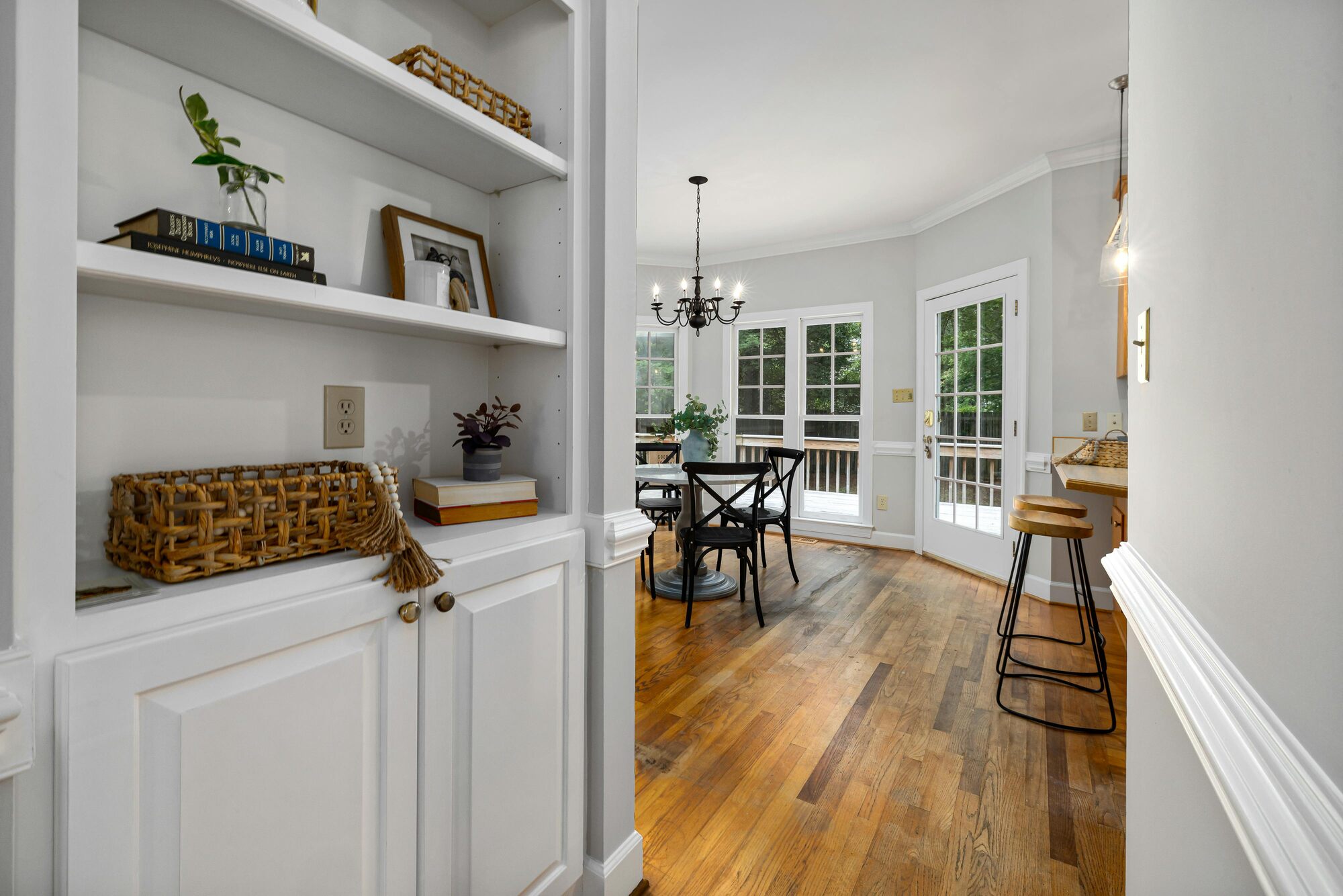 Built-in shelving and dining nook in a Cedar, MN custom home by Willet Remodeling and Construction.