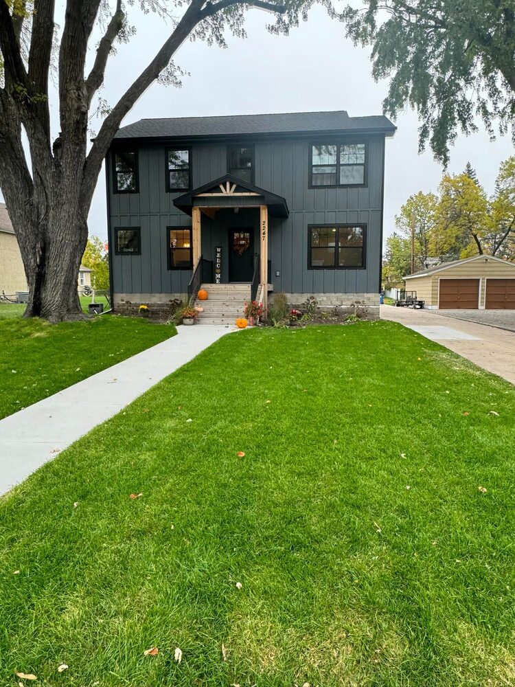 Front yard and porch view of a new custom home project in Edina, MN by Willet Remodeling and Construction.