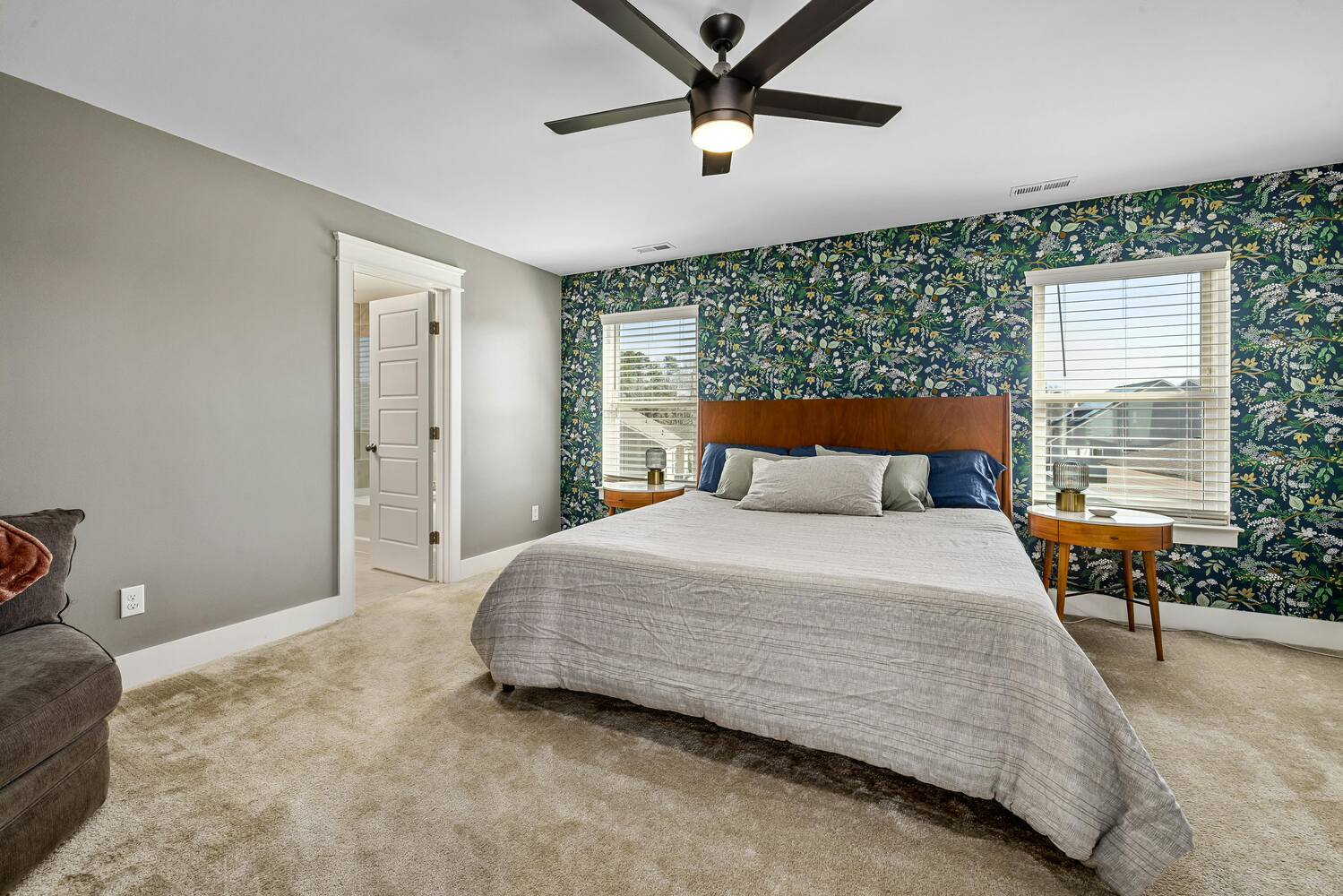Stock Photo of Bright master bedroom with statement wallpaper in East Bethel, MN.