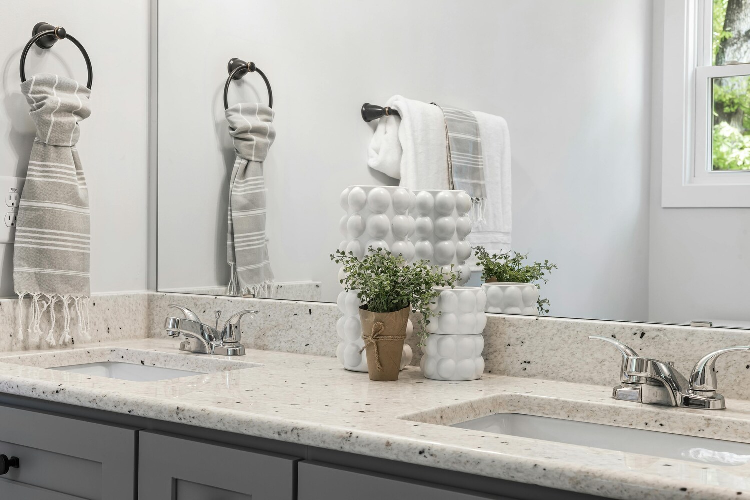 Stock Photo of Double vanity with granite countertop in custom home bathroom in East Bethel, MN.