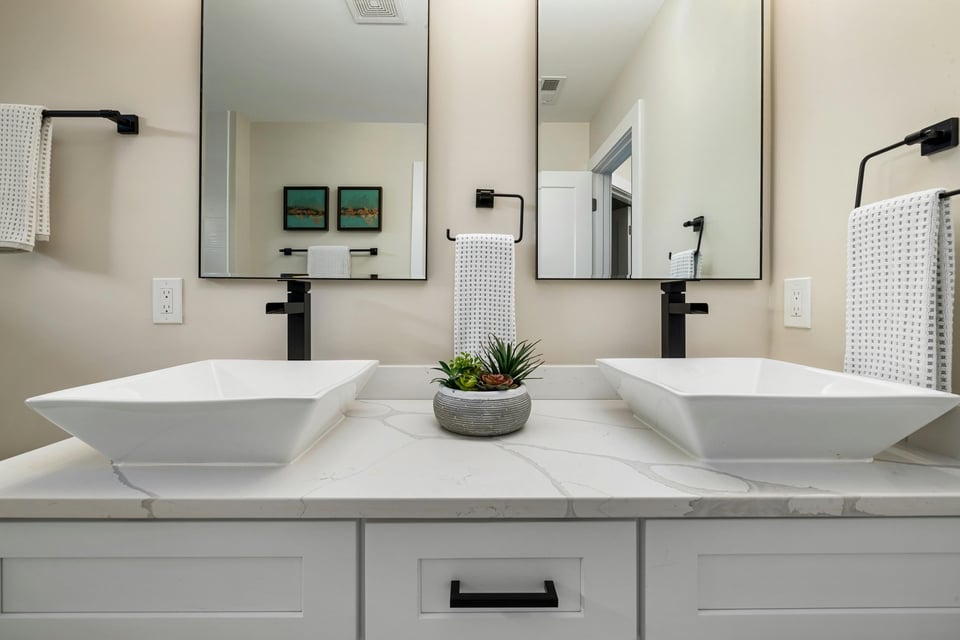 Stock Photo of Twin rectangular sinks on white countertop in custom bathroom in Minneapolis, MN.