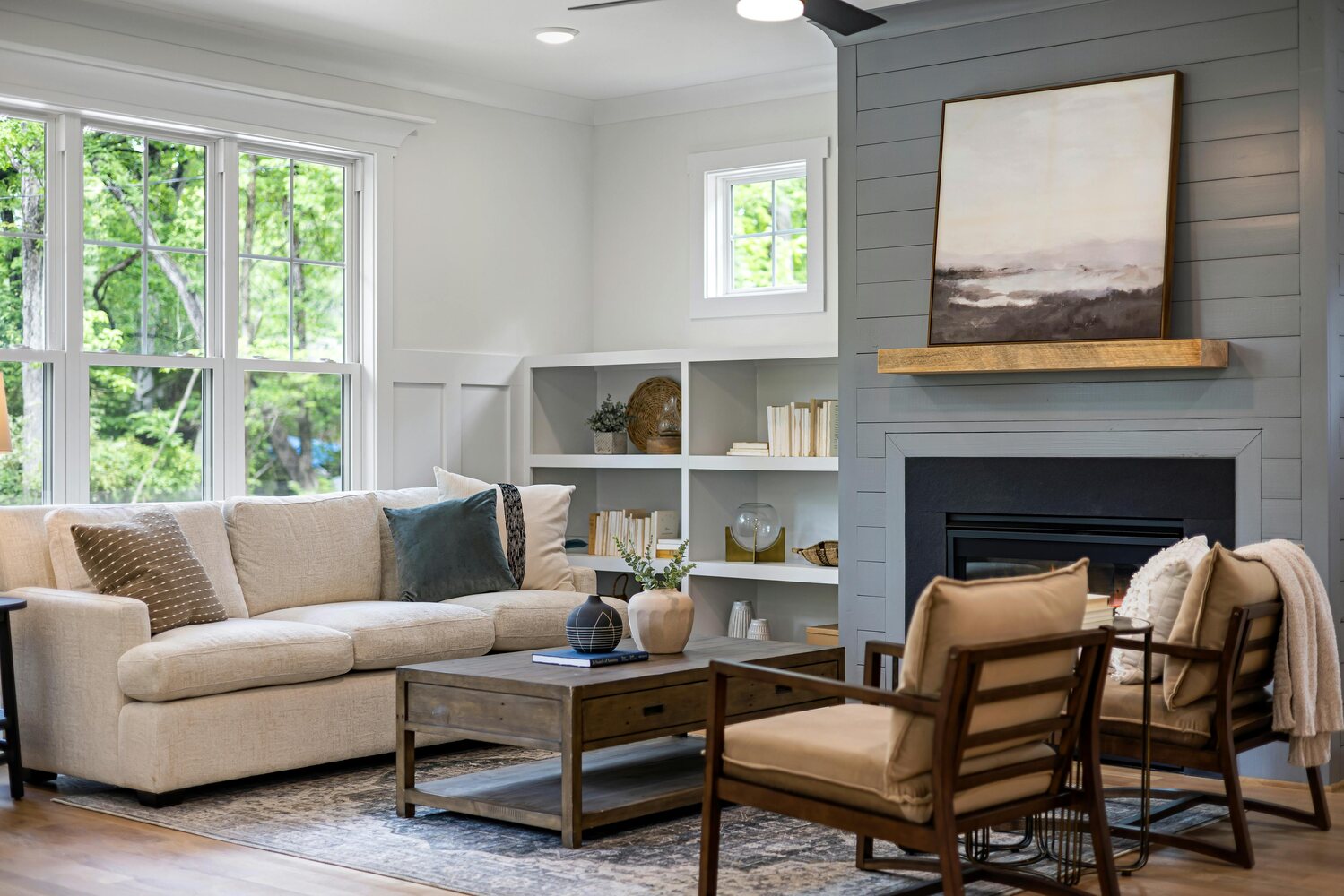 Stock Photo of Warm and inviting living room with wood fireplace and built-in shelves in Minneapolis, MN.