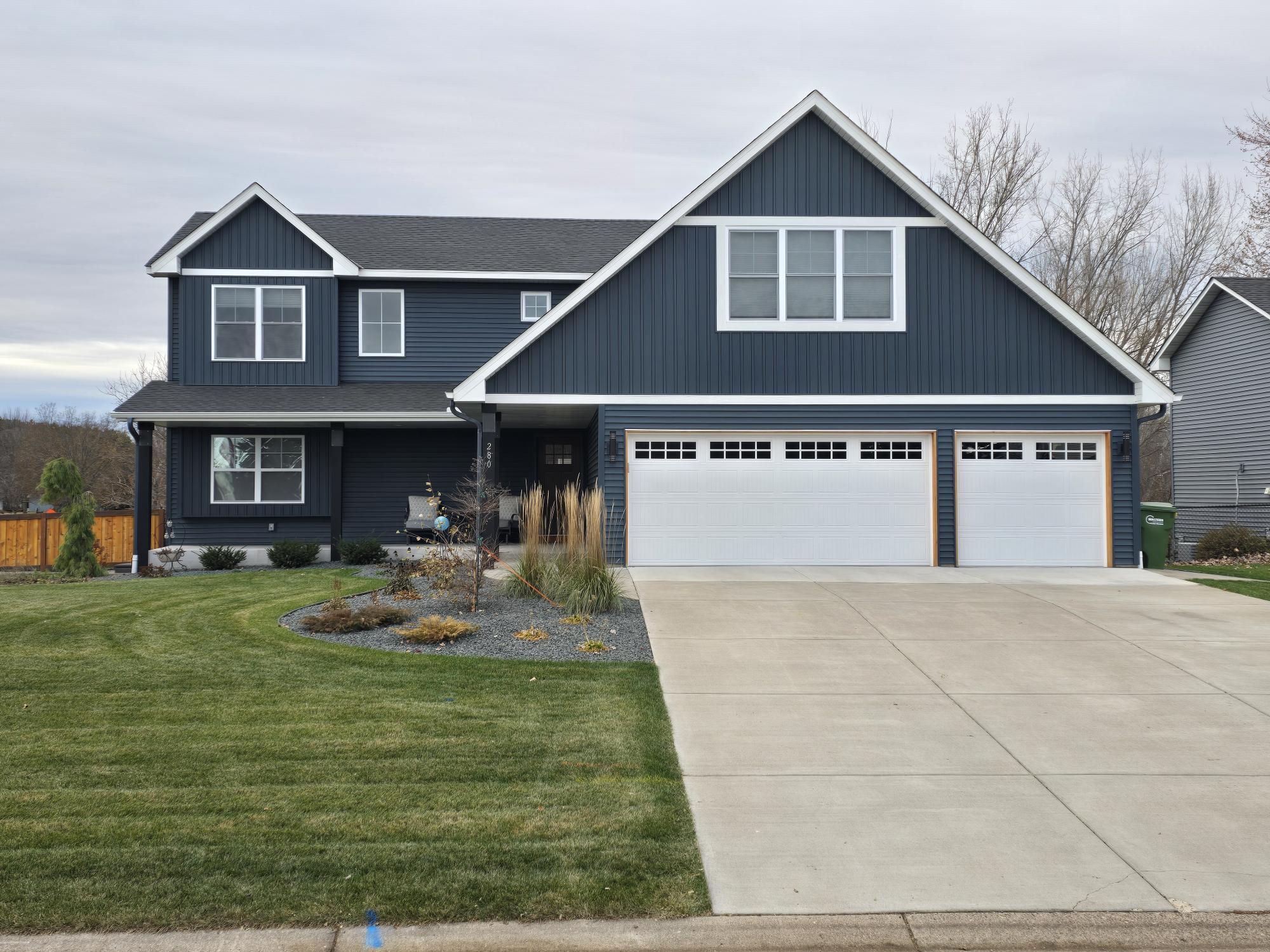 Modern new construction home exterior blue siding by Willet Remodeling and Construction