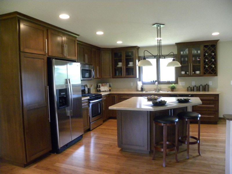 L-shaped kitchen design featuring island and pendant lighting in Oak Grove, MN by Willet Remodeling and Construction.