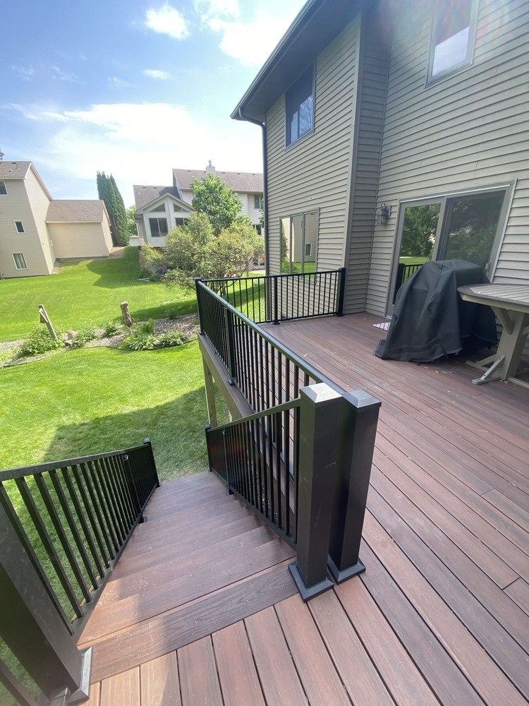 View from upper deck with rich brown composite boards by Willet Remodeling and Construction in East Bethel, MN.